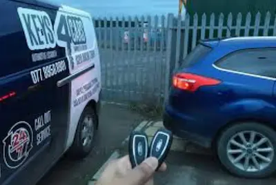 New replacement car key and remote fob programmed by an auto locksmith